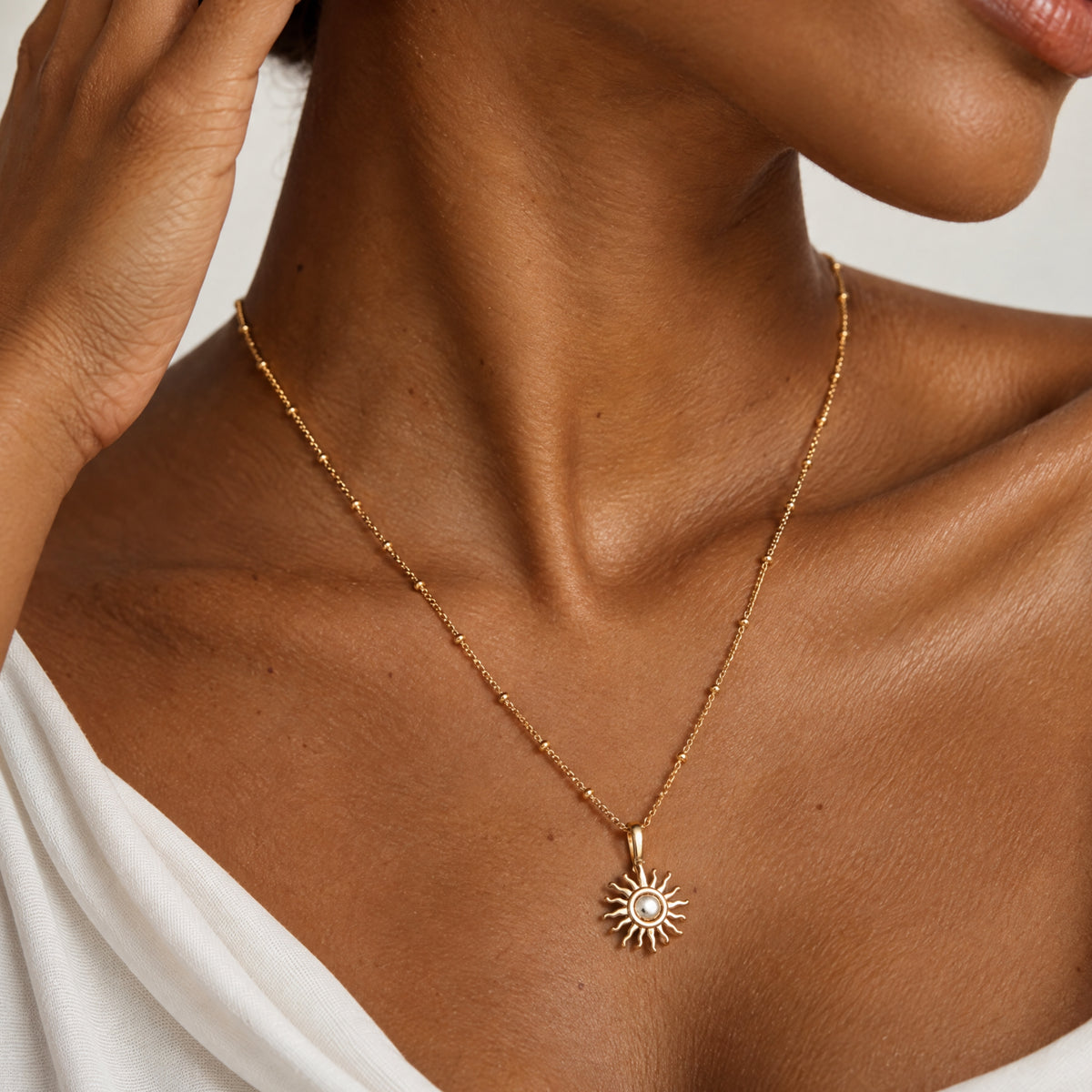Gold sun necklace